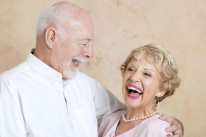 Elderly Couple Holding Each Other and Laughing